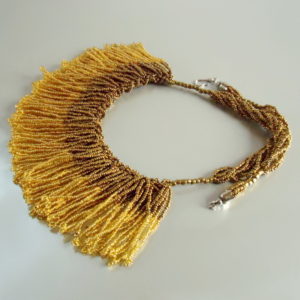 Gold Tasselled Bib - HMJServices